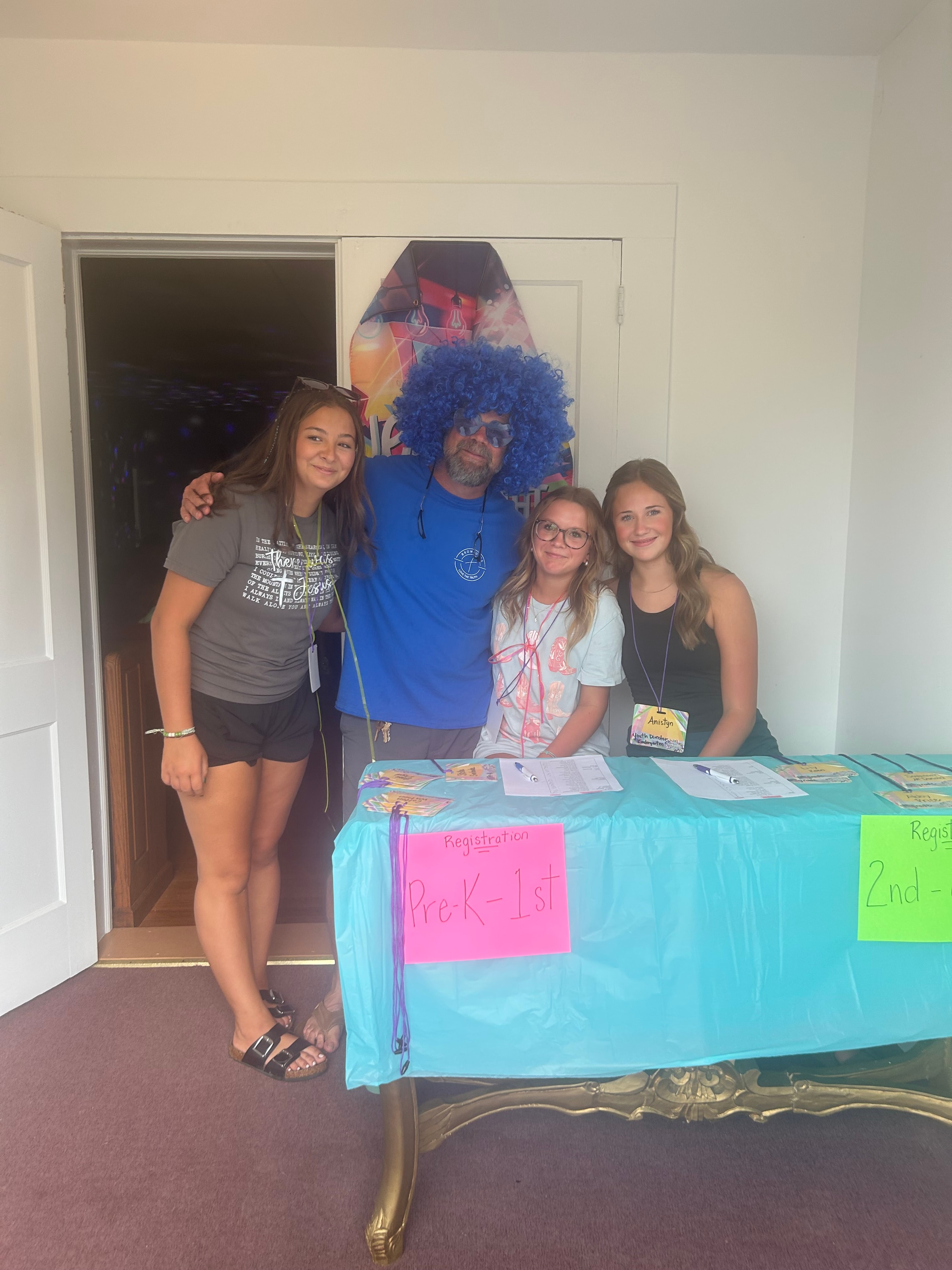 VBS registration team at the Pre-K through 1st grade table